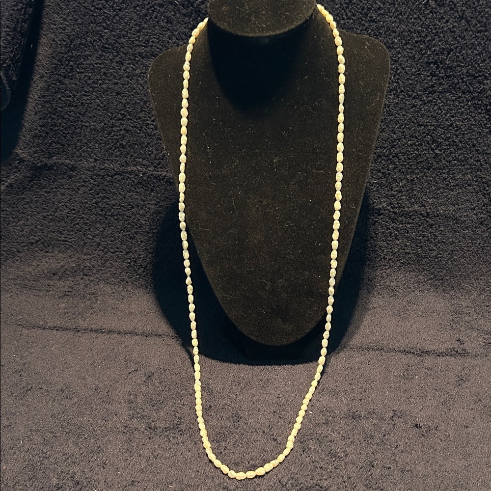 Necklace Fresh Water Pearls. Single Strand. Approximately 32 inches long.